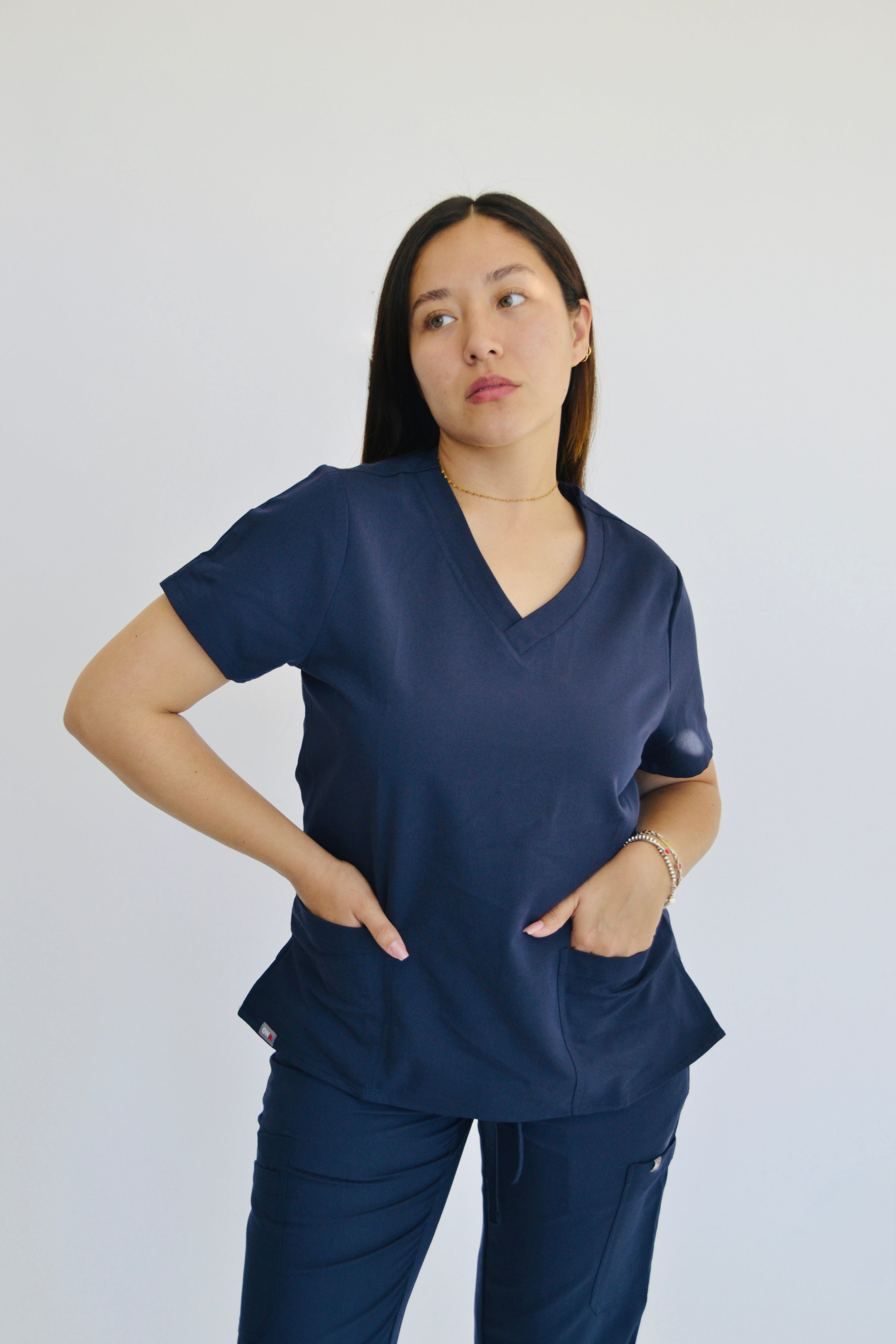 TENA V-NECK TOP WITH 2 HAND POCKETS