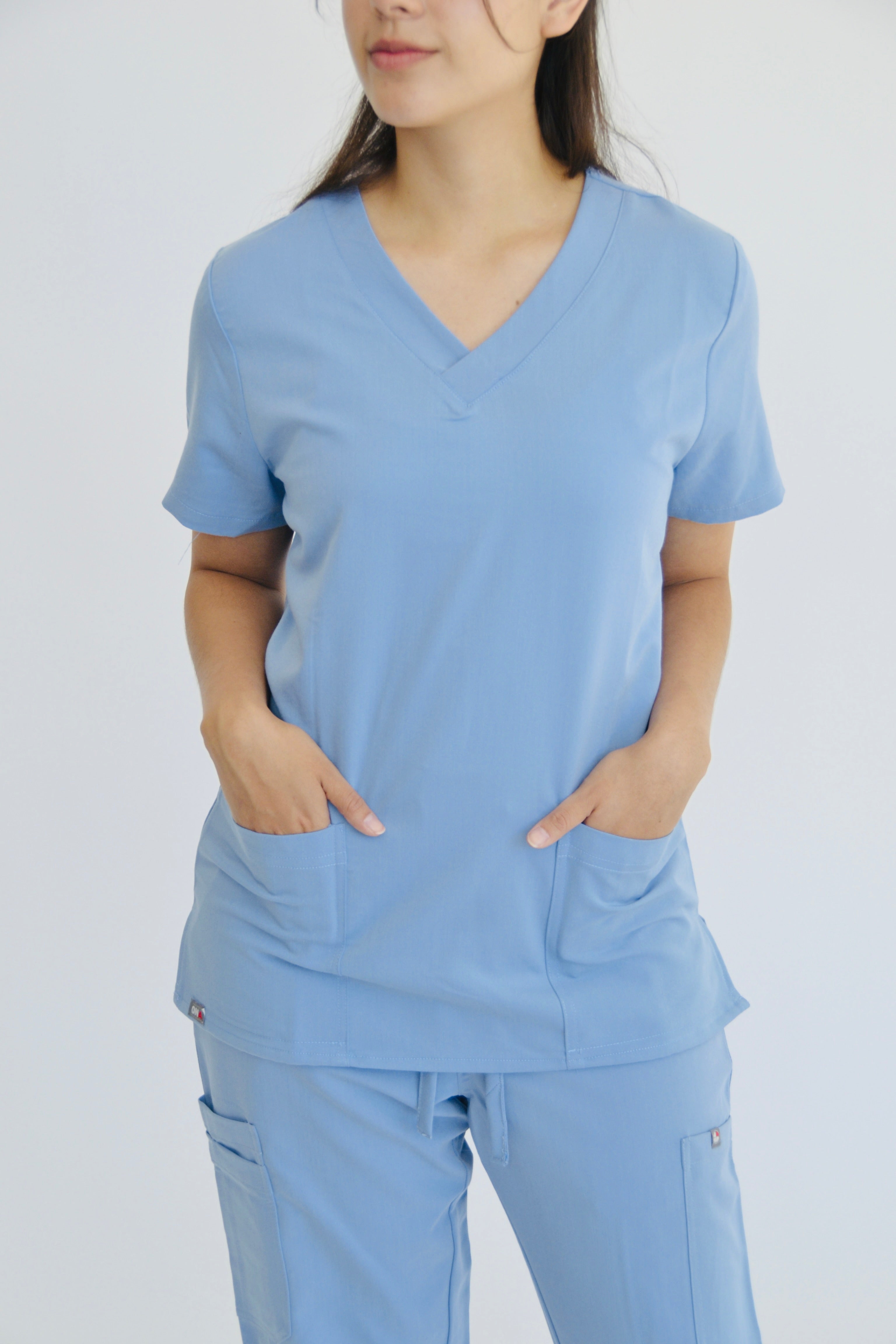 TENA V-NECK TOP WITH 2 HAND POCKETS